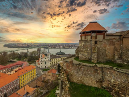 beautiful sunset over Esztergom city center and castle in Hungary with the Danube and Sturovo Slovakia in the backgroundのeditorial素材