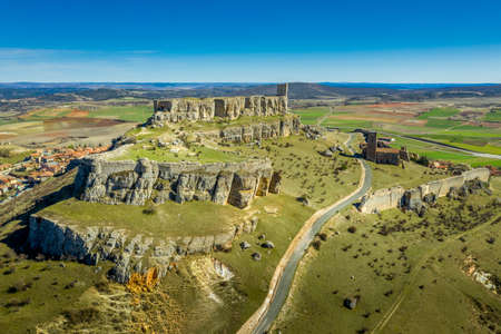 Atienza aerial panorama with blue sky of medieval ruined castle and town with city walls in Castille and Leon Spainのeditorial素材