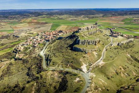Atienza aerial panorama with blue sky of medieval ruined castle and town with city walls in Castille and Leon Spainのeditorial素材
