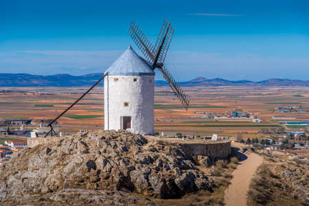 Consuegra castle and windmills aerial view with blue sky in La Mancha Spain famous Don Quixote site