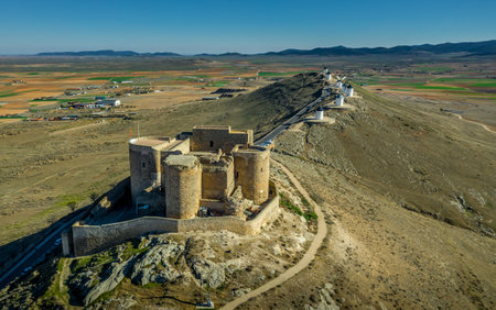 Consuegra castle and windmills aerial view with blue sky in La Mancha Spain famous Don Quixote siteのeditorial素材
