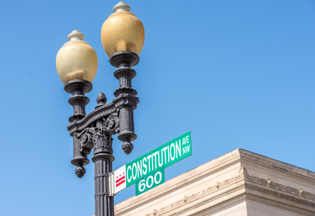 Iron lamp post with constitution avenue sign in Washington DCのeditorial素材