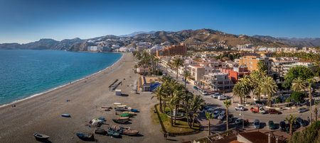 Almunecar aerial view of popular Mediterranean beach town with medieval castle in Spainのeditorial素材
