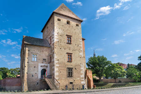 Aerial view of medieval Gothic Simontornya castle protecting the cross on the Sio river  in Tolna county Hungary with restored donjon, palace, brick walls blue cloudy skyのeditorial素材