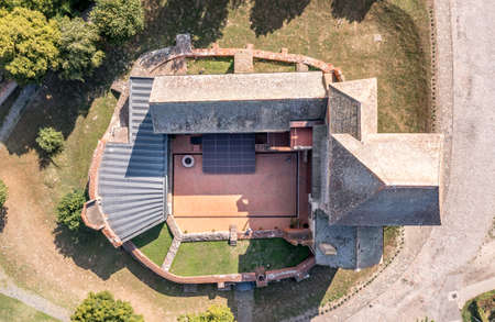 Aerial view of medieval Gothic Simontornya castle protecting the cross on the Sio river  in Tolna county Hungary with restored donjon, palace, brick walls blue cloudy skyのeditorial素材