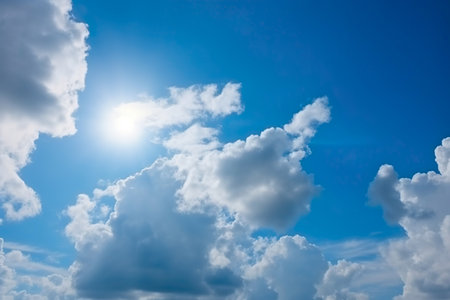 Blue sky background with white clouds. Cumulus white clouds in the blue sky.の素材