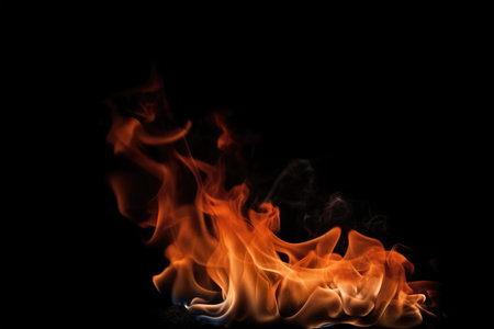 Fire flames isolated on black background with copy space for your text.の素材