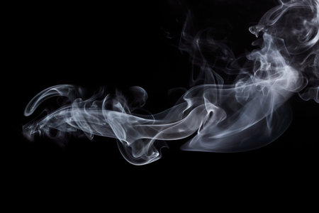 Smoke isolated on black background. Abstract white smoke on black background.の素材