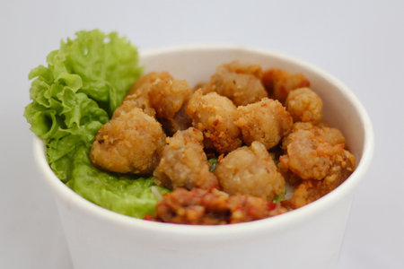 A rice bowl with a green leafy saladの写真素材