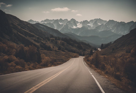Road in the mountains with blue sky and clouds - retro vintage effectの素材