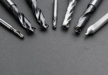 multi cutting tools special set. Reamer, end mill, drill. material Carbide and high speed steel, coating Titanium nitride. Used for metal work. isolated on dark background.の写真素材