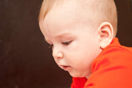 baby looking away close-up portrait.の写真素材