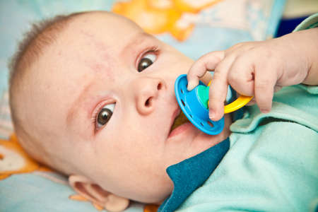 portrait of a baby looking at the cameraの写真素材