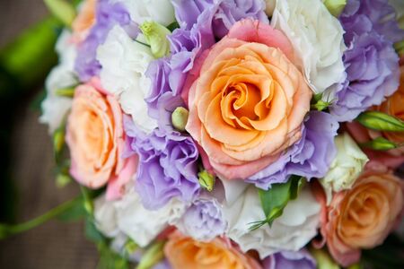 wedding rings on bridal bouquet close upの写真素材
