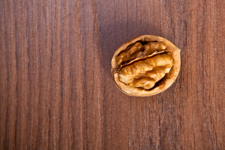 chopped walnuts on a wooden background
