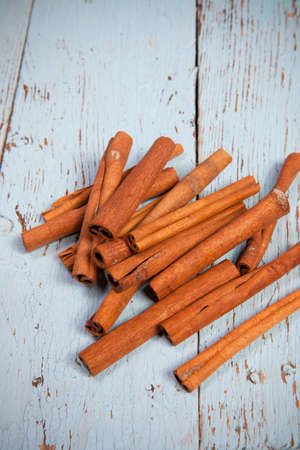 Cinnamon sticks on wooden backgroundの写真素材