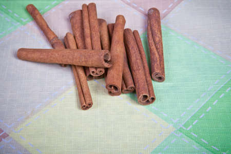 cinnamon sticks on a plaid backgroundの写真素材