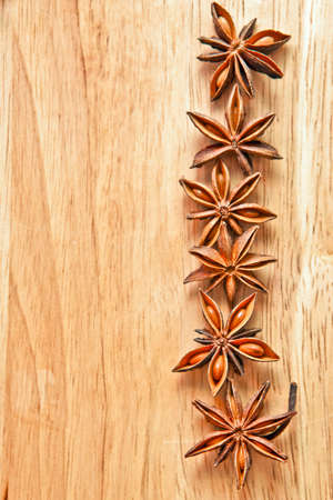 Asterisks anise on a wooden boardの写真素材