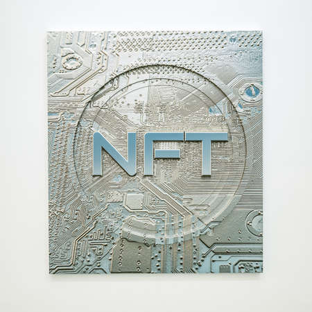 silver token with the inscription nft on a white background. crypto art concept. 3d render illustrationの写真素材