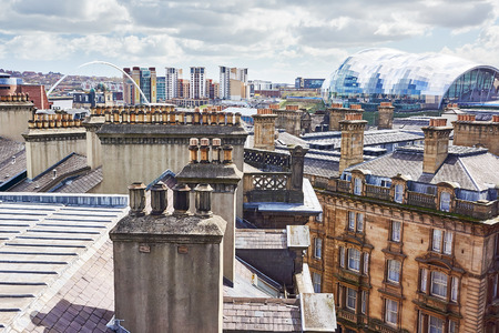 NEWCASTLE UPON TYNE QUAYSIDE, ENGLAND, UK - APRIL 26, 2013: Newcastle City Skyline with the Millennium Bridge and The Sage in the distance.のeditorial素材