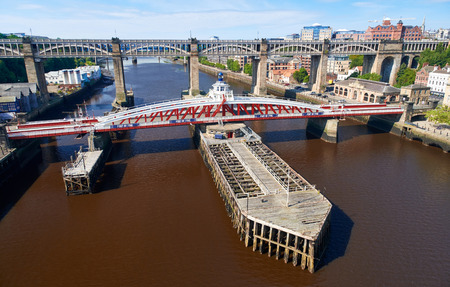 NEWCASTLE UPON TYNE, ENGLAND, UK - AUGUST 13, 2015: The Swing & High Level bridges over the river Tyne at Newcastle.のeditorial素材