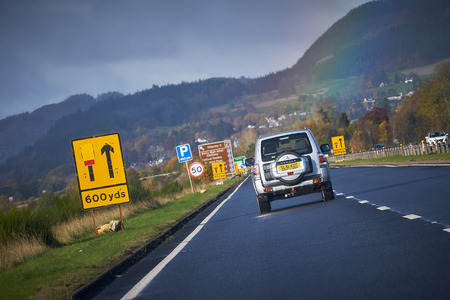A9 MOTORWAY PITLOCHRY, SCOTLAND, UK - NOVEMBER 05, 2016: A Mitsubishi Shogun approaching roadworks near Pitlochry A9 MOTORWAY PITLOCHRY, SCOTLAND, UK - NOVEMBER 05, 2016: A Mitsubishi Shogun approaching roadworks near Pitlochry
