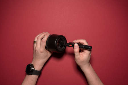 man is cleaning a lenseの写真素材