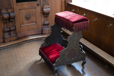 an old traditional confessional with red velvetの写真素材