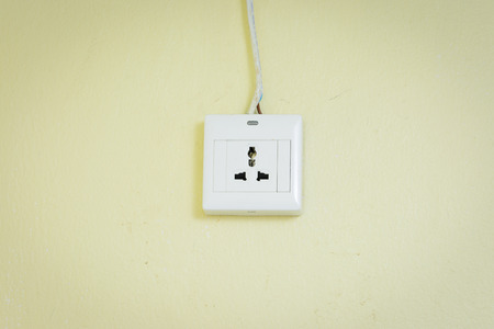 Socket on yellow wall.の写真素材