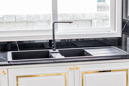 Close up of modern kitchen faucet and sinkの写真素材