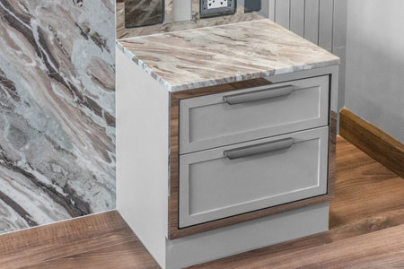 Close-up of the room's white wood cabinetsの写真素材