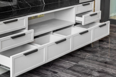 Close-up of the room's white wood cabinetsの写真素材