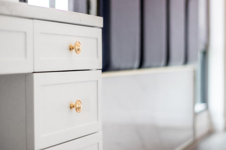 Close-up of the room's white wood cabinetsの写真素材