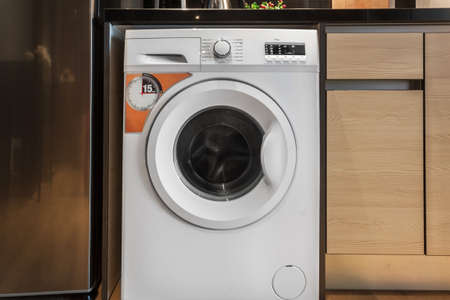 Clothes washing machine in room interiorの写真素材