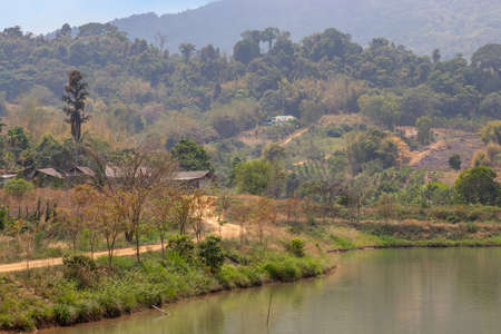 A dirt road in the countryside in the mountains of Thailandの写真素材