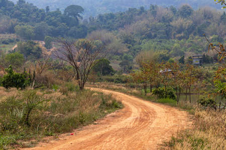 A dirt road in the countryside in the mountains of Thailandの写真素材