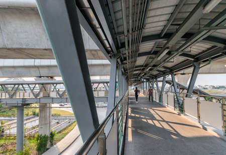 People walk on the BTS Skywalk in Bang Khen District.のeditorial素材