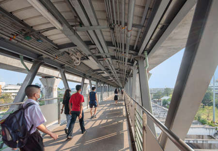 People walk on the BTS Skywalk in Bang Khen District.のeditorial素材