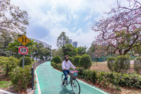 Woman People Riding a Bicycle in the Parkのeditorial素材