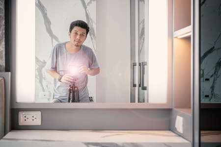 portrait of young asian male Real estate photographer in Houseの写真素材