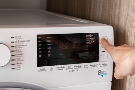 Close-Up white washing machine control panel In laundry room.の写真素材