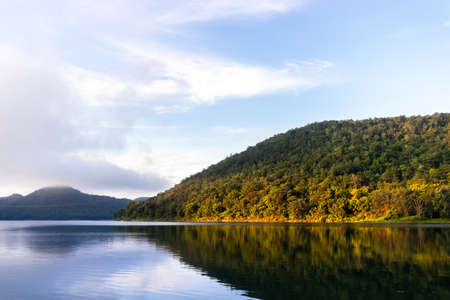 sunrise and sunset at the mountain range in the lakeの写真素材