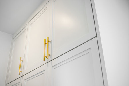 house boasts white cabinetry and drawers as part of its design interior.の写真素材