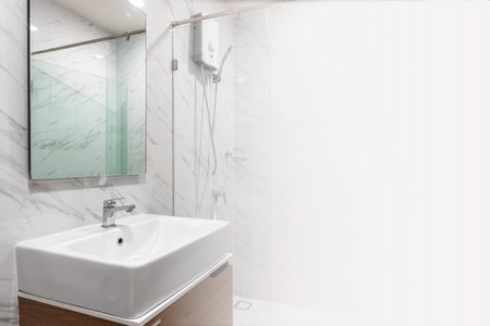 Clean sink with white light, concept of cleanliness and hygiene in the home.の写真素材