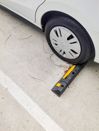Brake barrier devices in outdoor parking lots help prevent accidents. from reversing the car into...