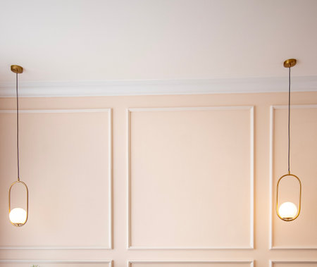 Wooden walls and elegant interior lamps inside a classic house.の写真素材