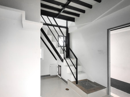 Steel stairs inside a white houseの写真素材
