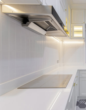 modern white kitchen with many cabinets and all the necessary built-inの写真素材