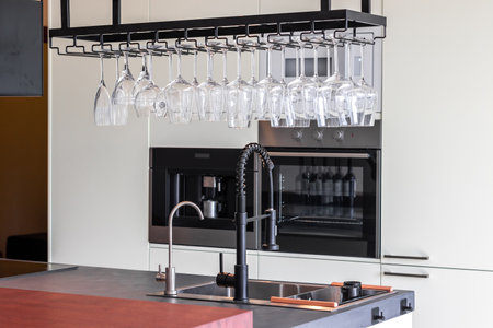 Microwave and oven built-in kitchen furniture in modern apartmentの写真素材