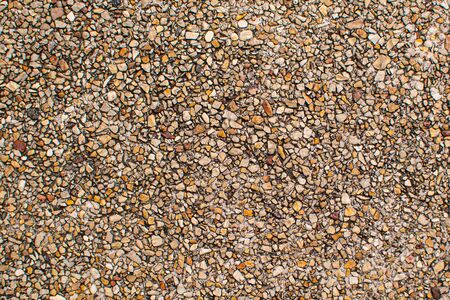 poppy seed background textured of brown sand wash gravel pool flooringの写真素材